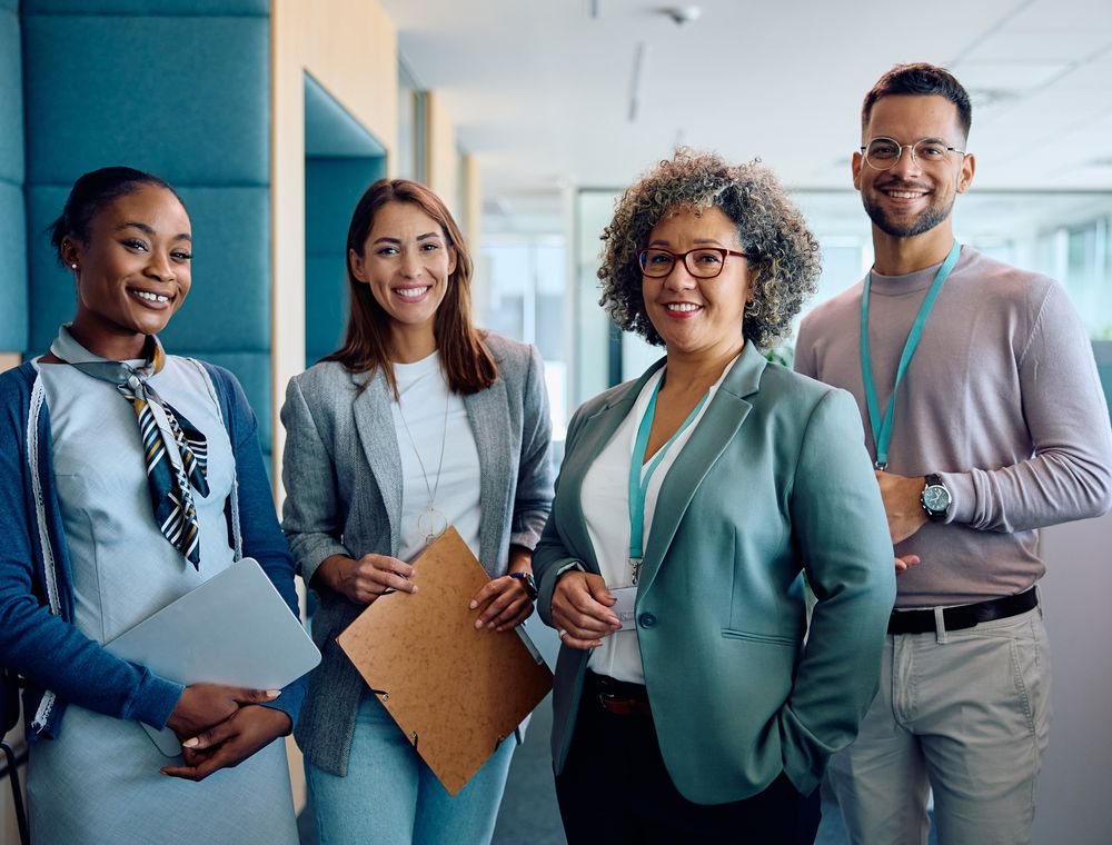 A diverse office team smiling together