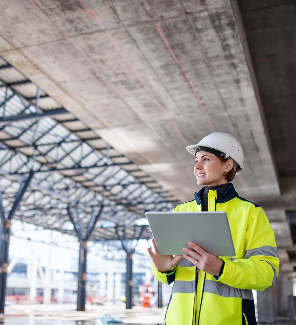 A site engineer holding a tablet