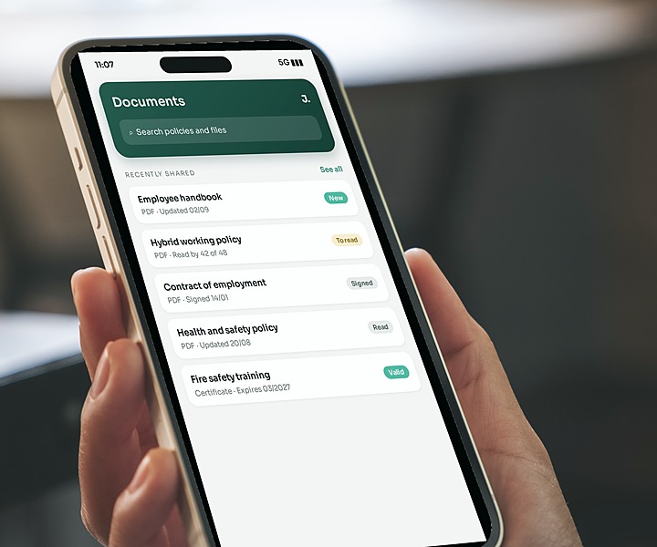 A hand holding a phone showing documents in the Jamie HR app